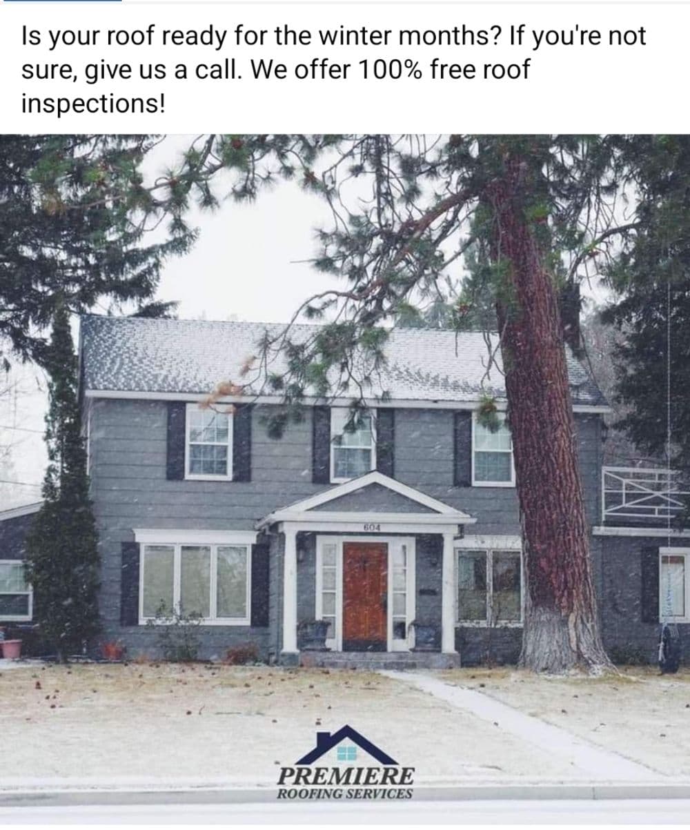 Gray house with snow, offering free roof inspections for winter readiness. Premier Roofing Services.